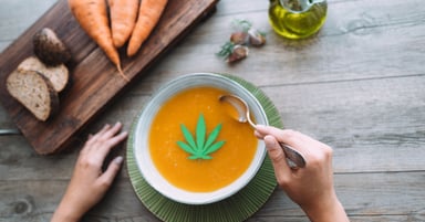 soup dish with cannabis leaf